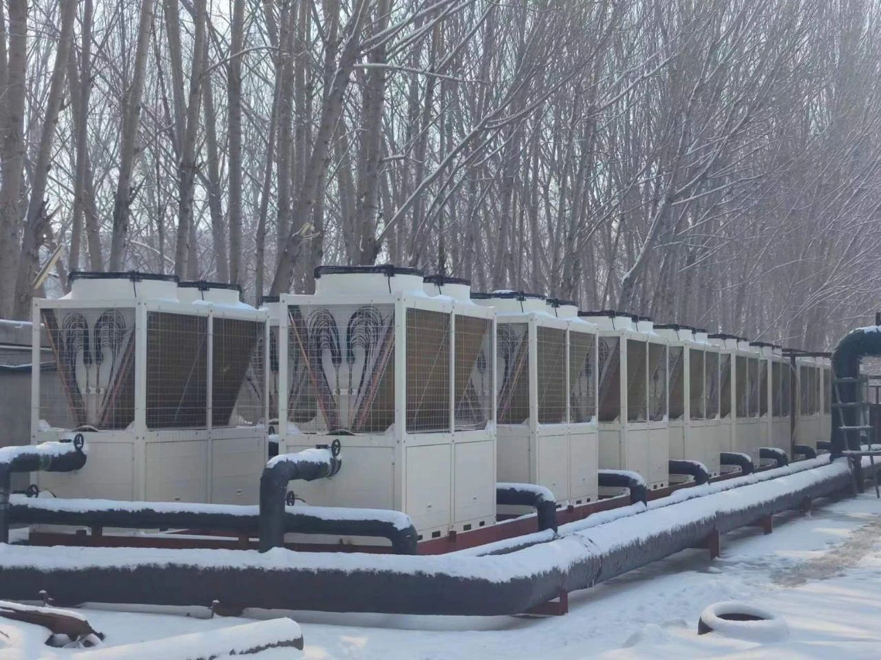 东北地区为何放弃集中供暖，采用九州酷游空气能热泵供暖